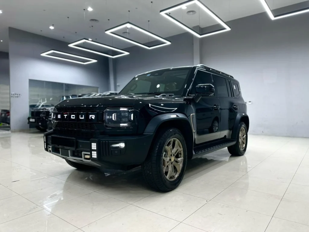 Black Jetour T2 2025 seen from the front three-quarter in the Hermas showroom