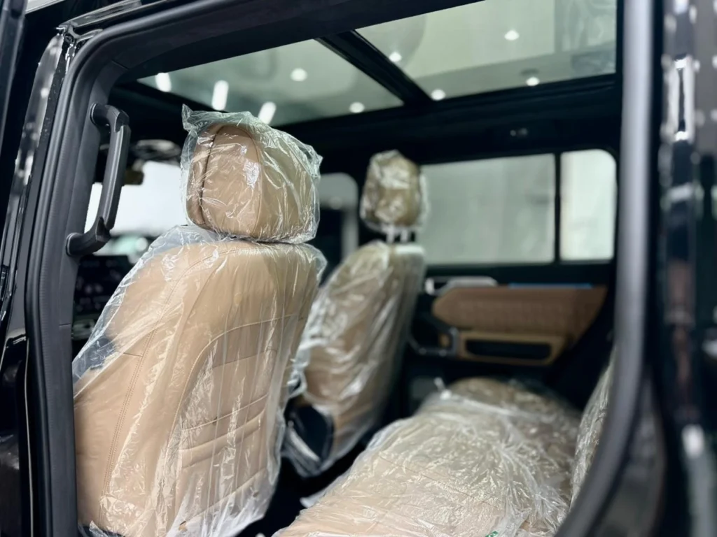Beige leather rear seats of the Jetour T2 2025 under delivery plastic